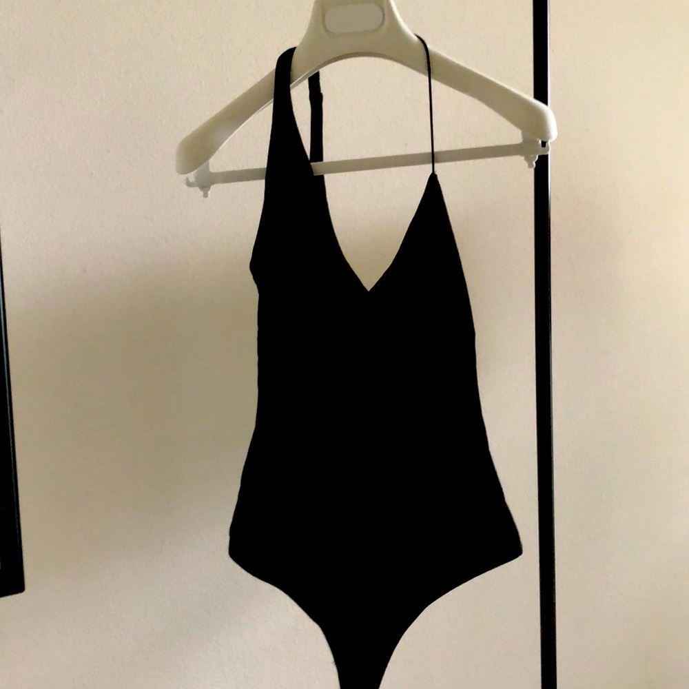 Thong bodysuit , asymmetric v-neck Alix NYC . Amazing fabric , beautiful piece
